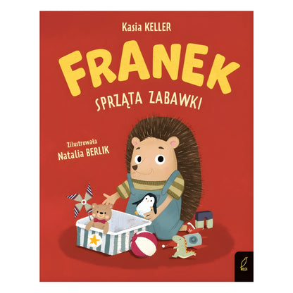 Okładka książki „Jeżyk Franek sprząta zabawki” - Franek w przedszkolu z zabawkami.